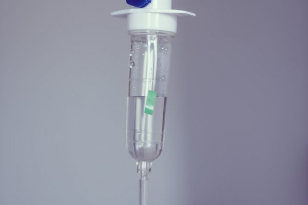 Infusion bottle with IV solution ( Filtered image processed vintage effect. )